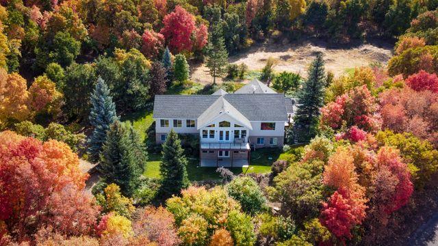 a large house in Utah surrounded by trees